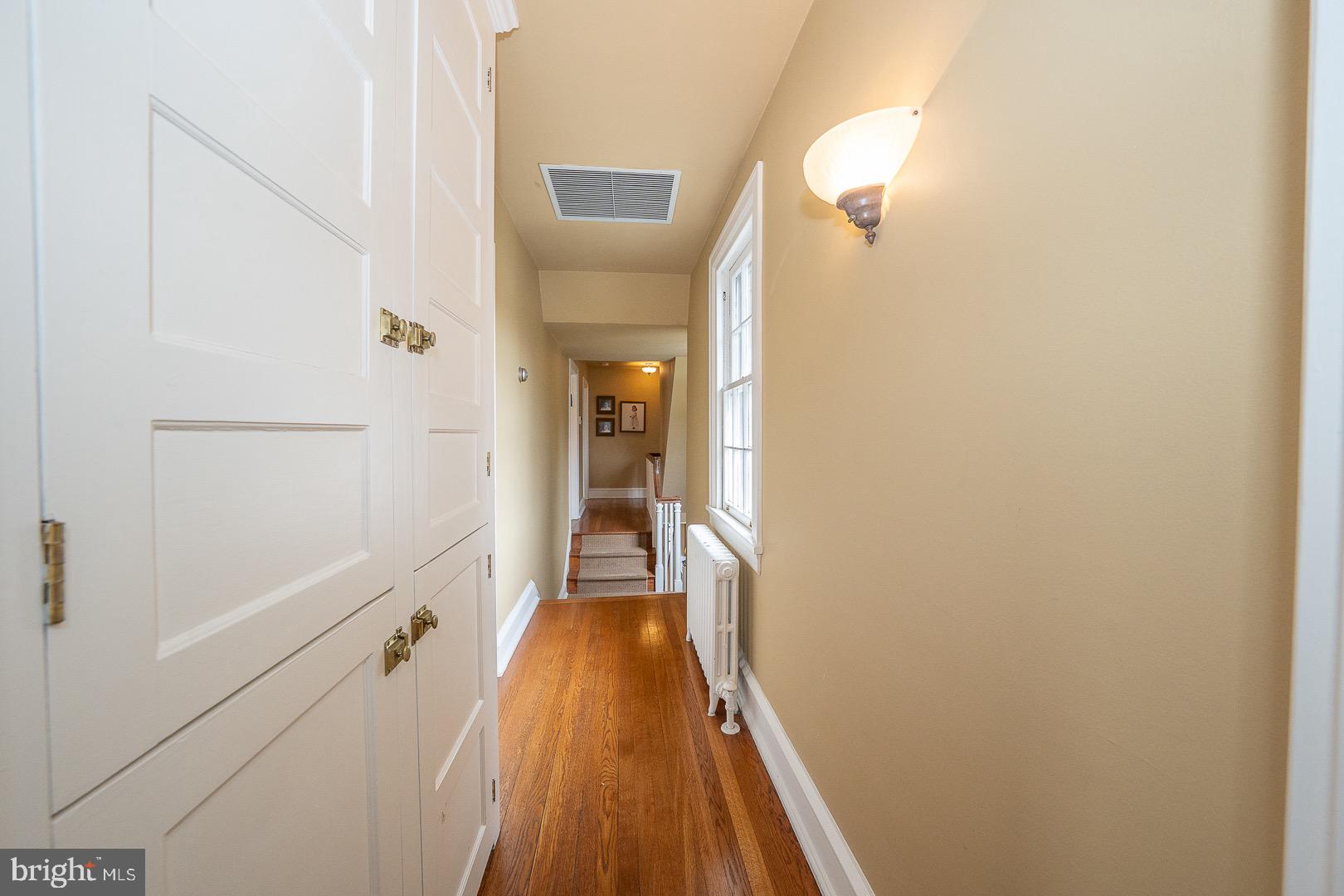 517 Howe Road Merion Station, PA 19066 - Photo 51 of 71 a view of a hallway with wooden floor and staircase