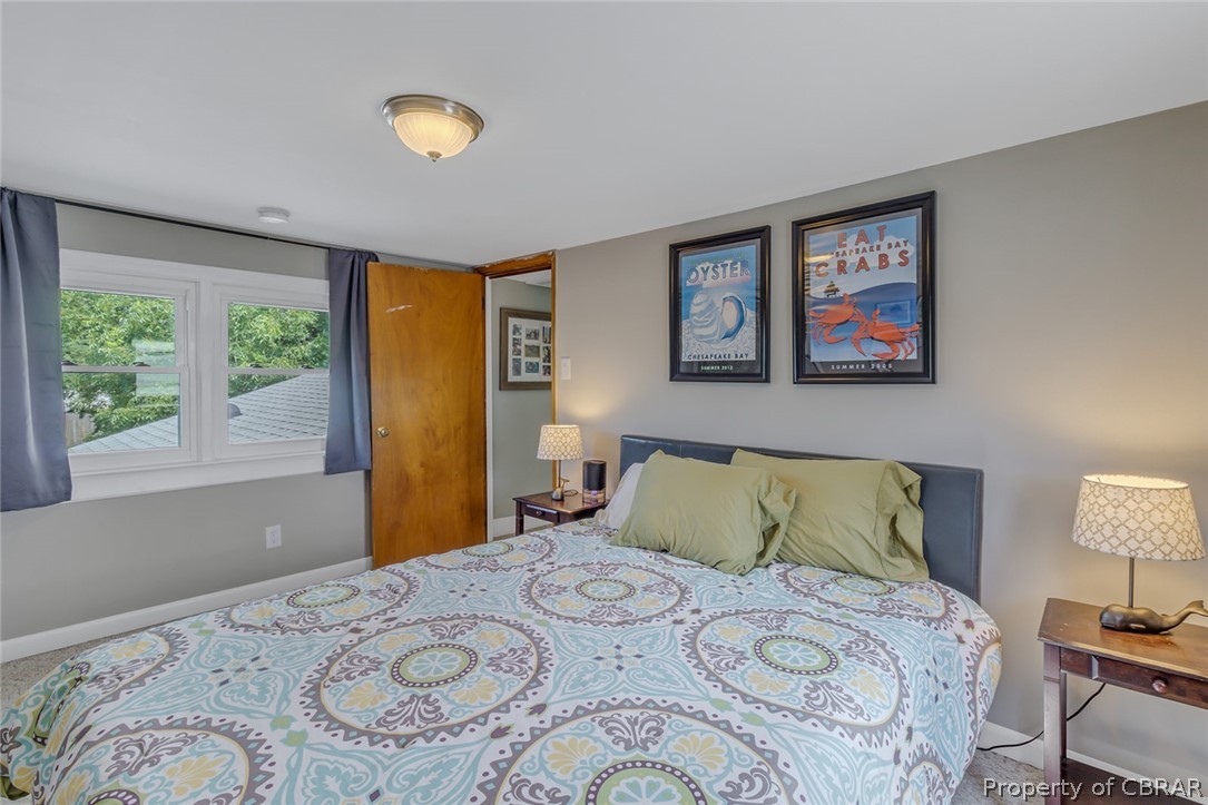 314 Callis Road Lancaster, VA 22503 - Photo 41 of 41 a bedroom with a bed and a window