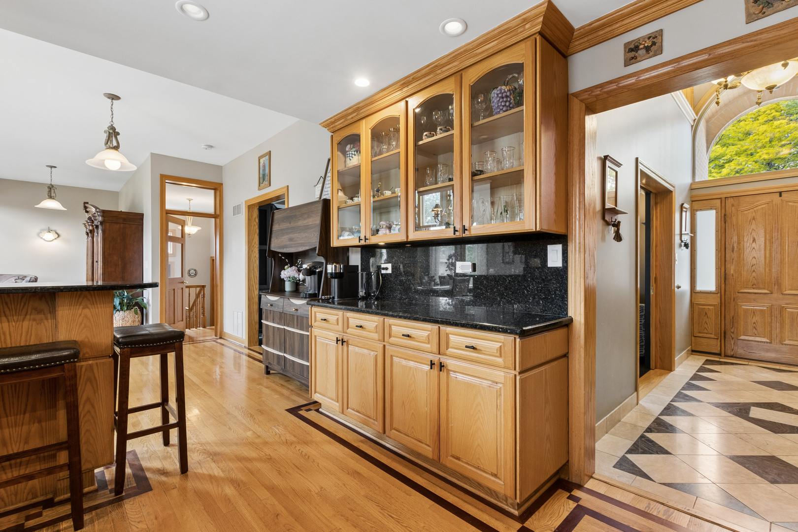7911 West Rascher Avenue Chicago, IL 60656 - Photo 19 of 39 a kitchen with granite countertop a stove a sink and a refrigerator