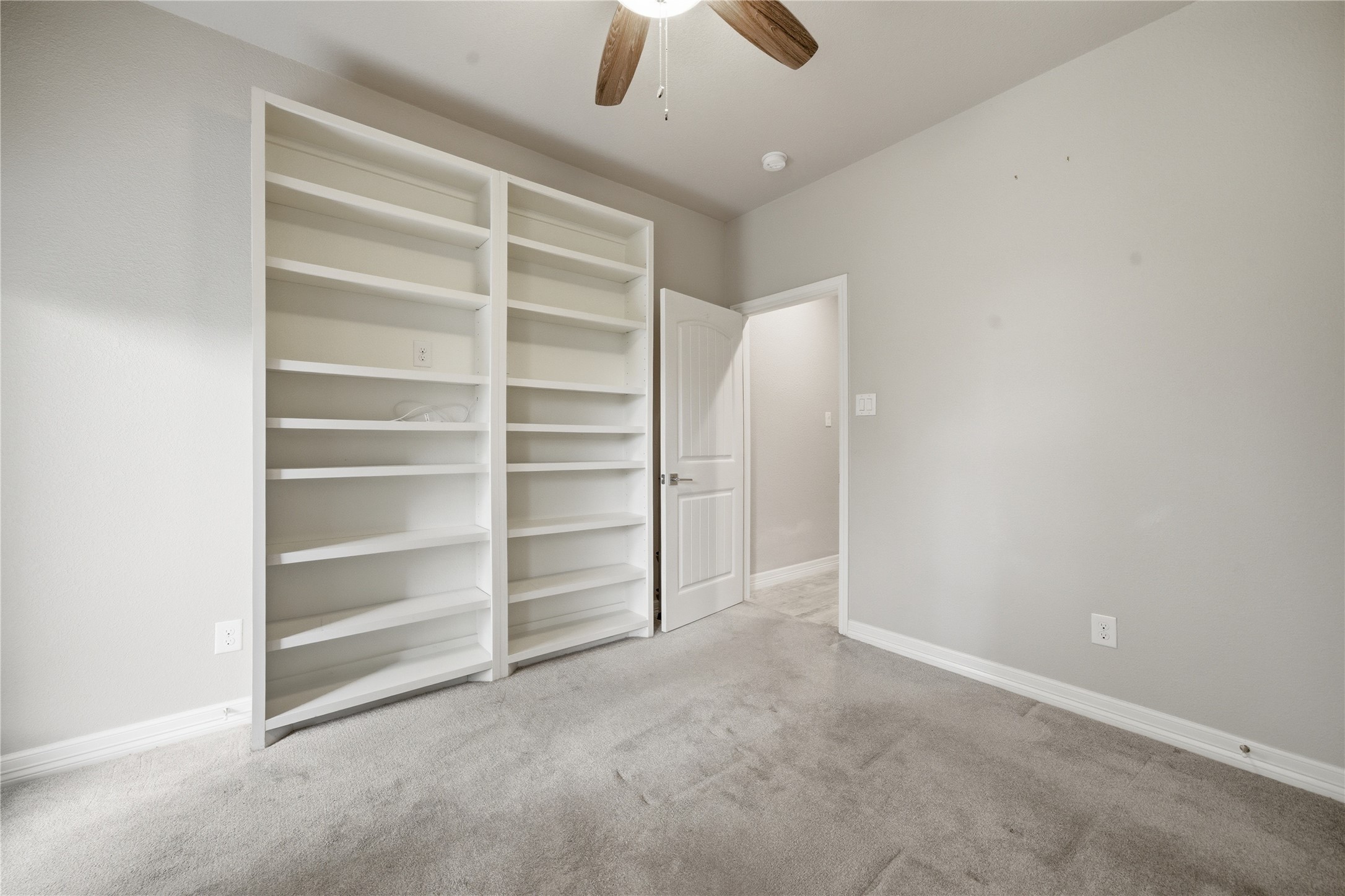 4412 New Orleans Street, Unit B Houston, TX 77020 - Photo 30 of 42 Built-in bookshelves provide options for the room to serve as a bedroom, study, or hobby space.