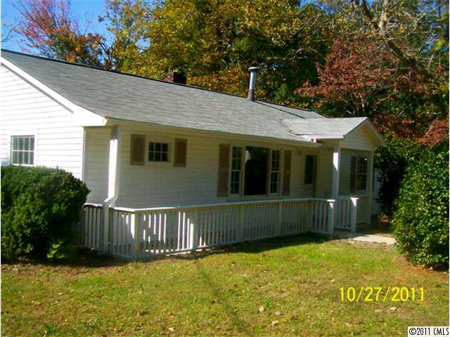 a view of house with backyard porch and entertaining space
