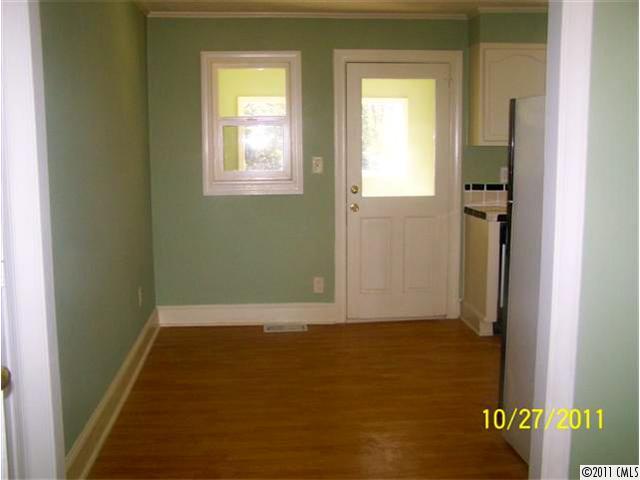 14024 Cabarrus Road Charlotte, NC 28227 - Photo 5 of 12 an empty room with windows