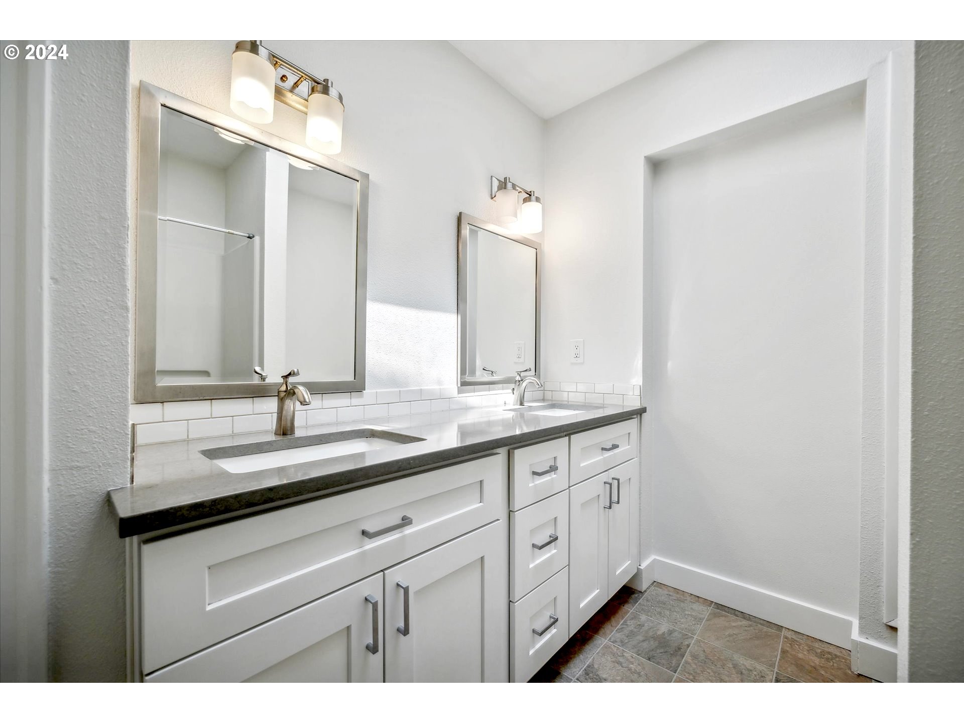 10097 Southwest Walker Road Portland, OR 97225 - Photo 18 of 44 a bathroom with a sink and a mirror