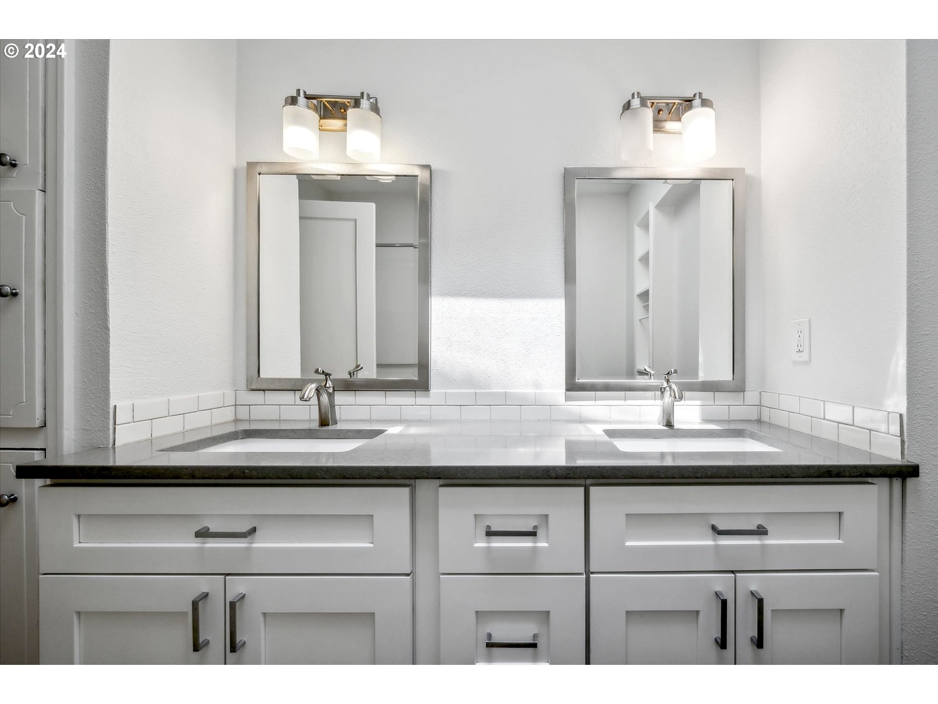10097 Southwest Walker Road Portland, OR 97225 - Photo 19 of 44 a bathroom with sink and mirror