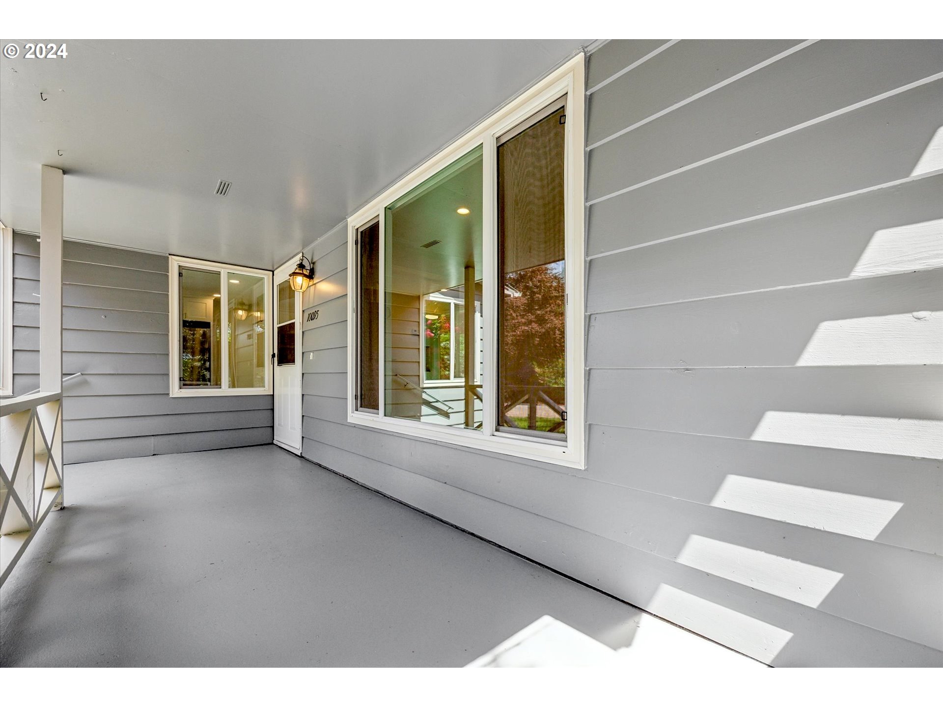 10097 Southwest Walker Road Portland, OR 97225 - Photo 2 of 44 a view of an empty room with a window