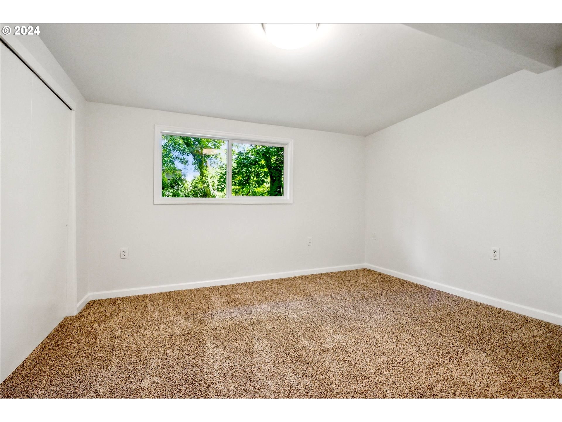 10097 Southwest Walker Road Portland, OR 97225 - Photo 21 of 44 an empty room with windows