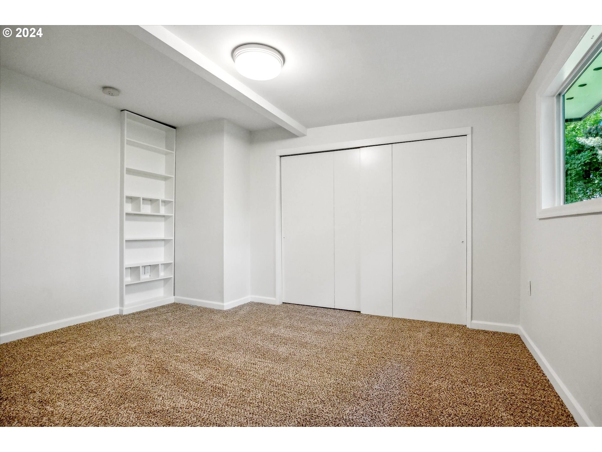 10097 Southwest Walker Road Portland, OR 97225 - Photo 22 of 44 a view of an empty room with a window