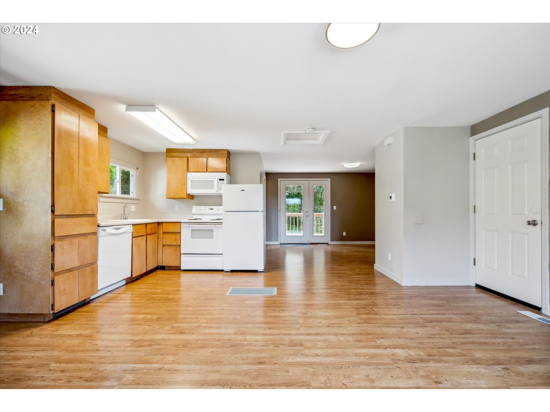 10097 Southwest Walker Road Portland, OR 97225 - Photo 24 of 44 a view of a kitchen with wooden floor