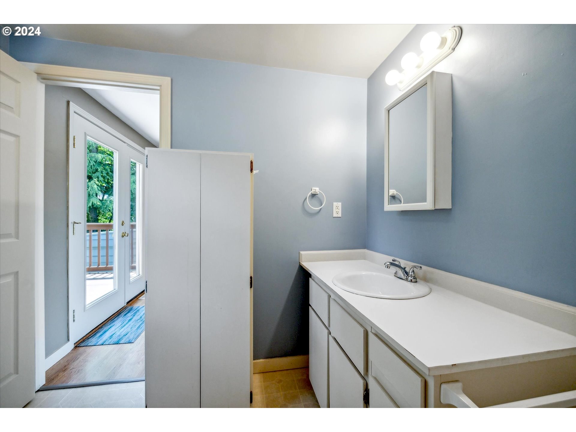 10097 Southwest Walker Road Portland, OR 97225 - Photo 32 of 44 a room with a sink cabinets and utility