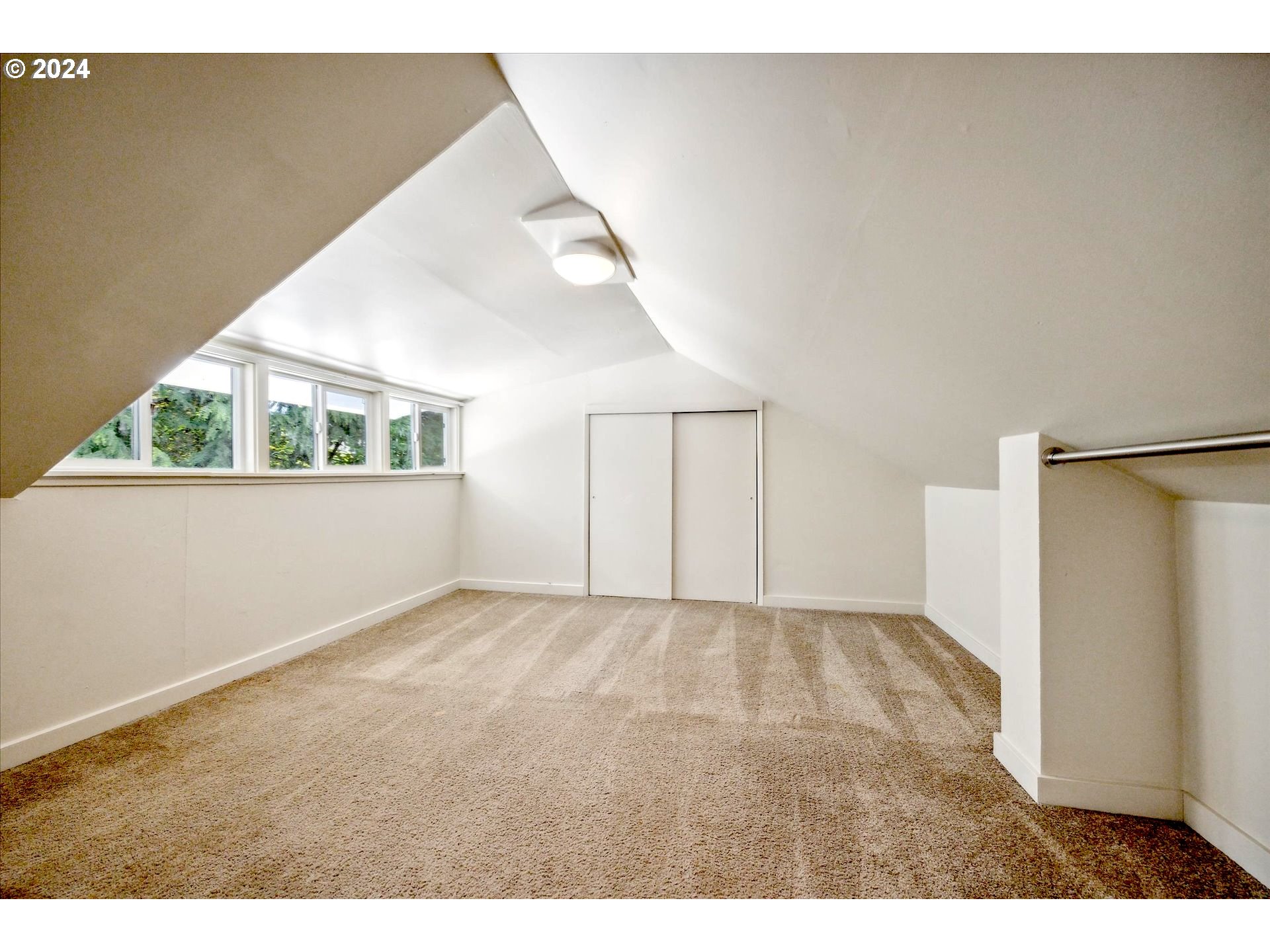 10097 Southwest Walker Road Portland, OR 97225 - Photo 33 of 44 a view of an empty room with a window