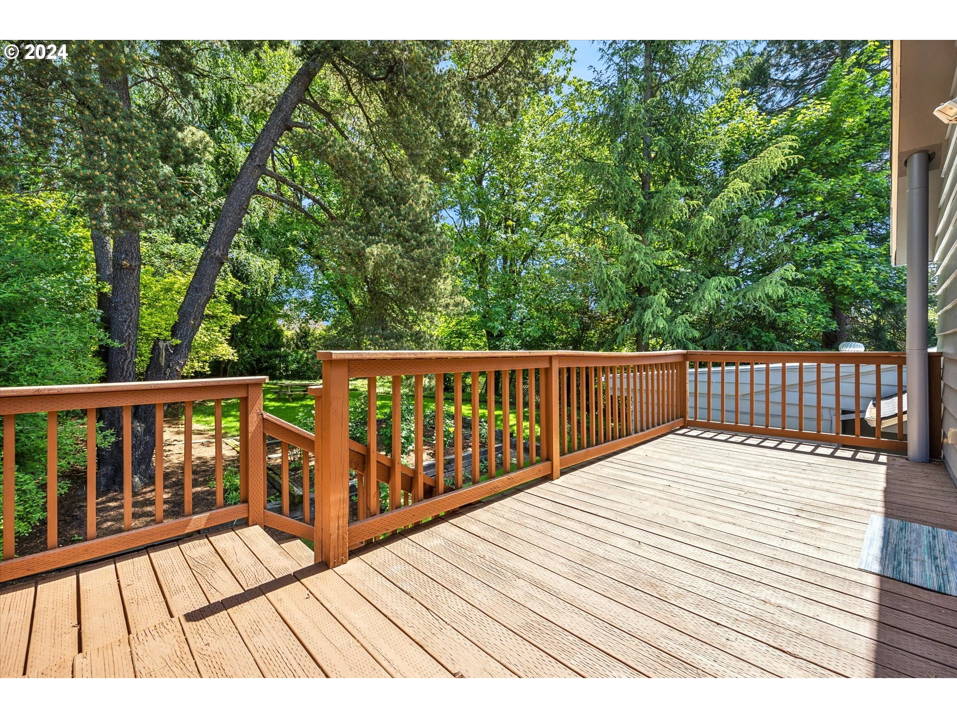 10097 Southwest Walker Road Portland, OR 97225 - Photo 35 of 44 a view of wooden deck and a garden