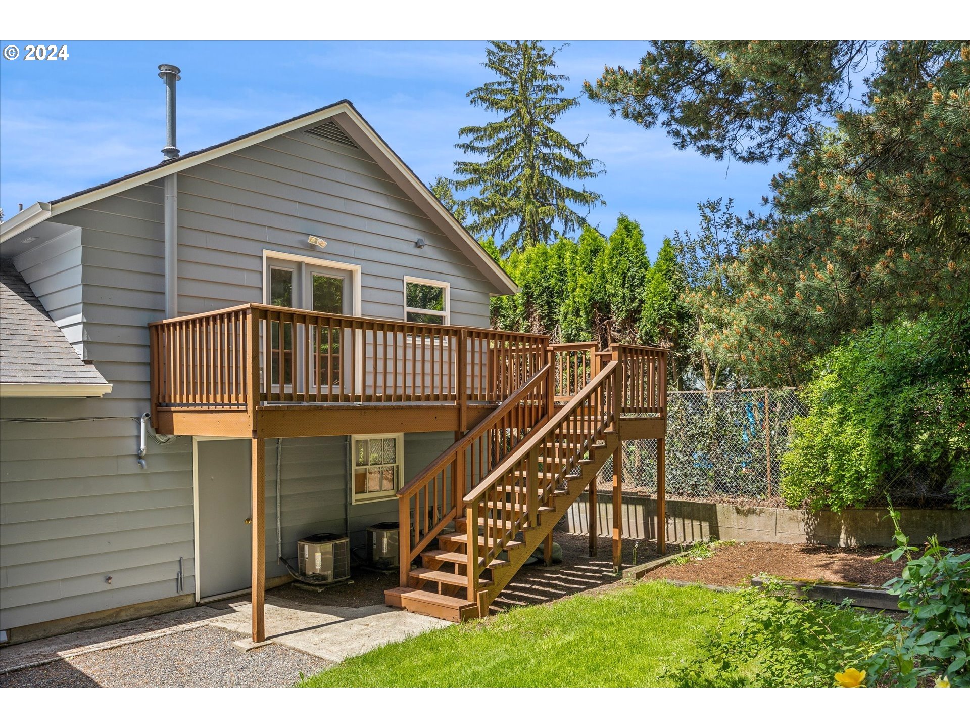 10097 Southwest Walker Road Portland, OR 97225 - Photo 36 of 44 a view of a house with a yard