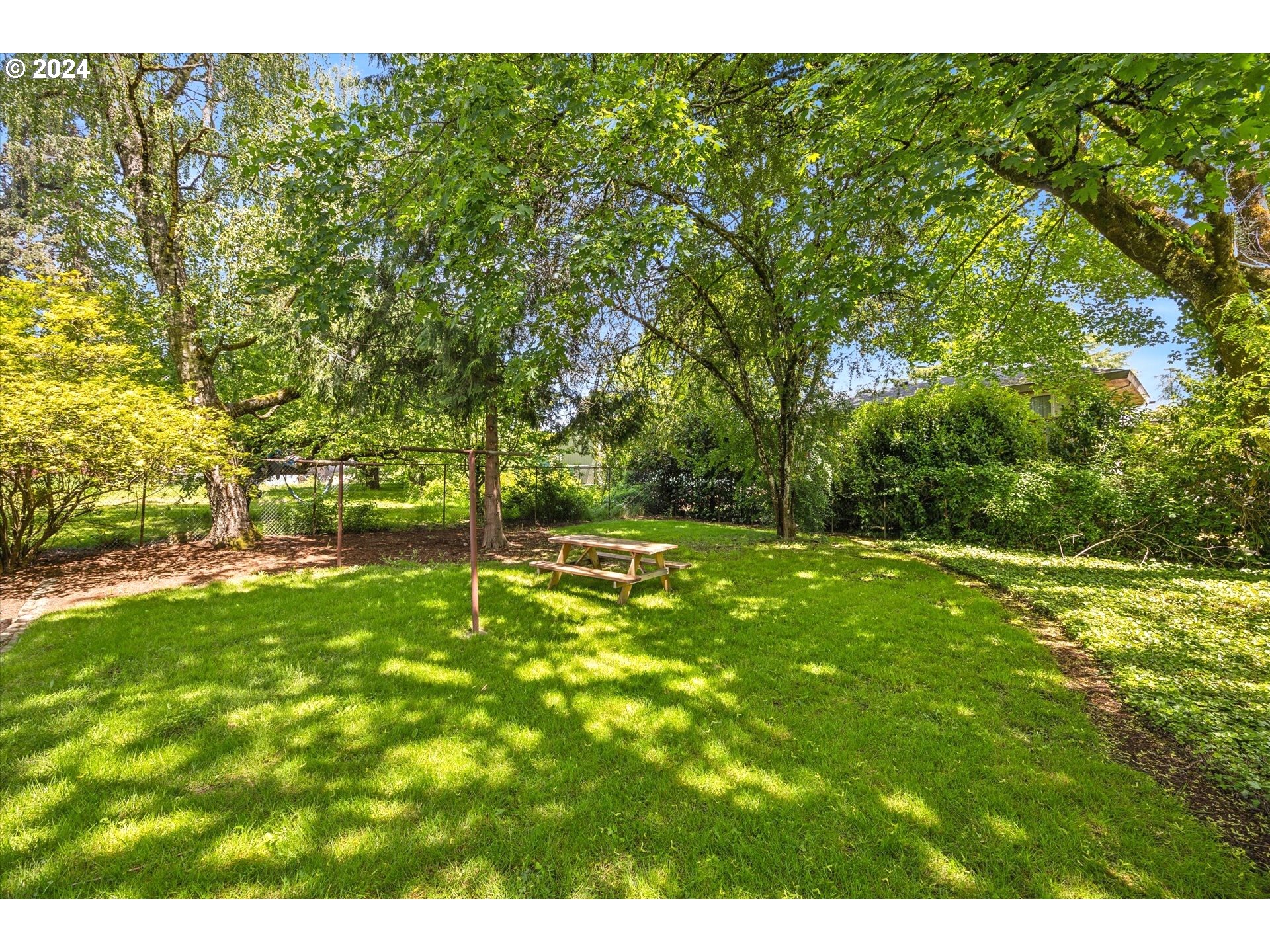 10097 Southwest Walker Road Portland, OR 97225 - Photo 38 of 44 a view of a field with a tree