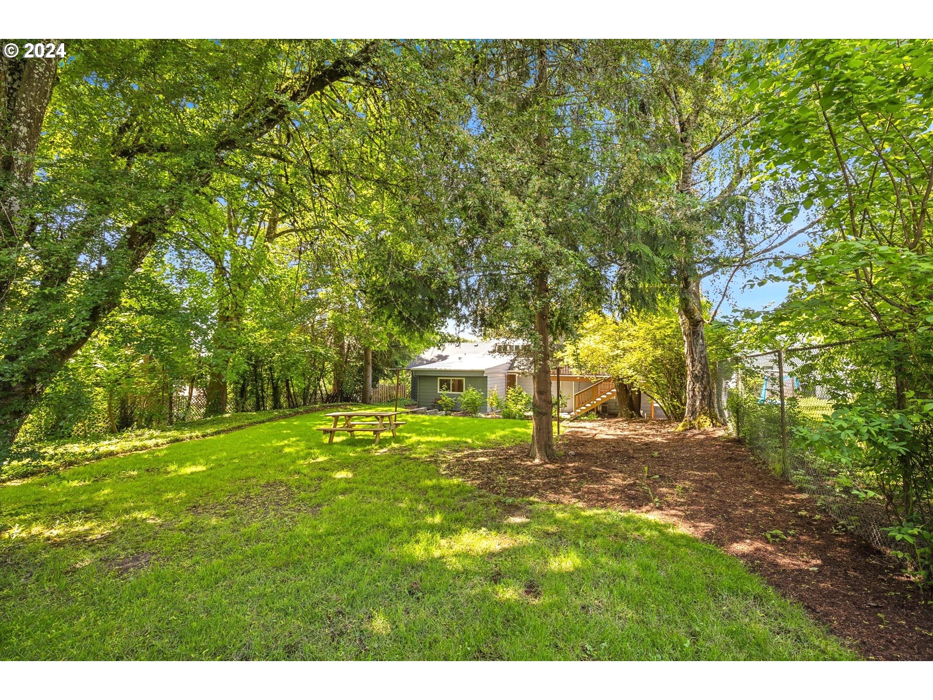 10097 Southwest Walker Road Portland, OR 97225 - Photo 40 of 44 a view of a backyard with large trees