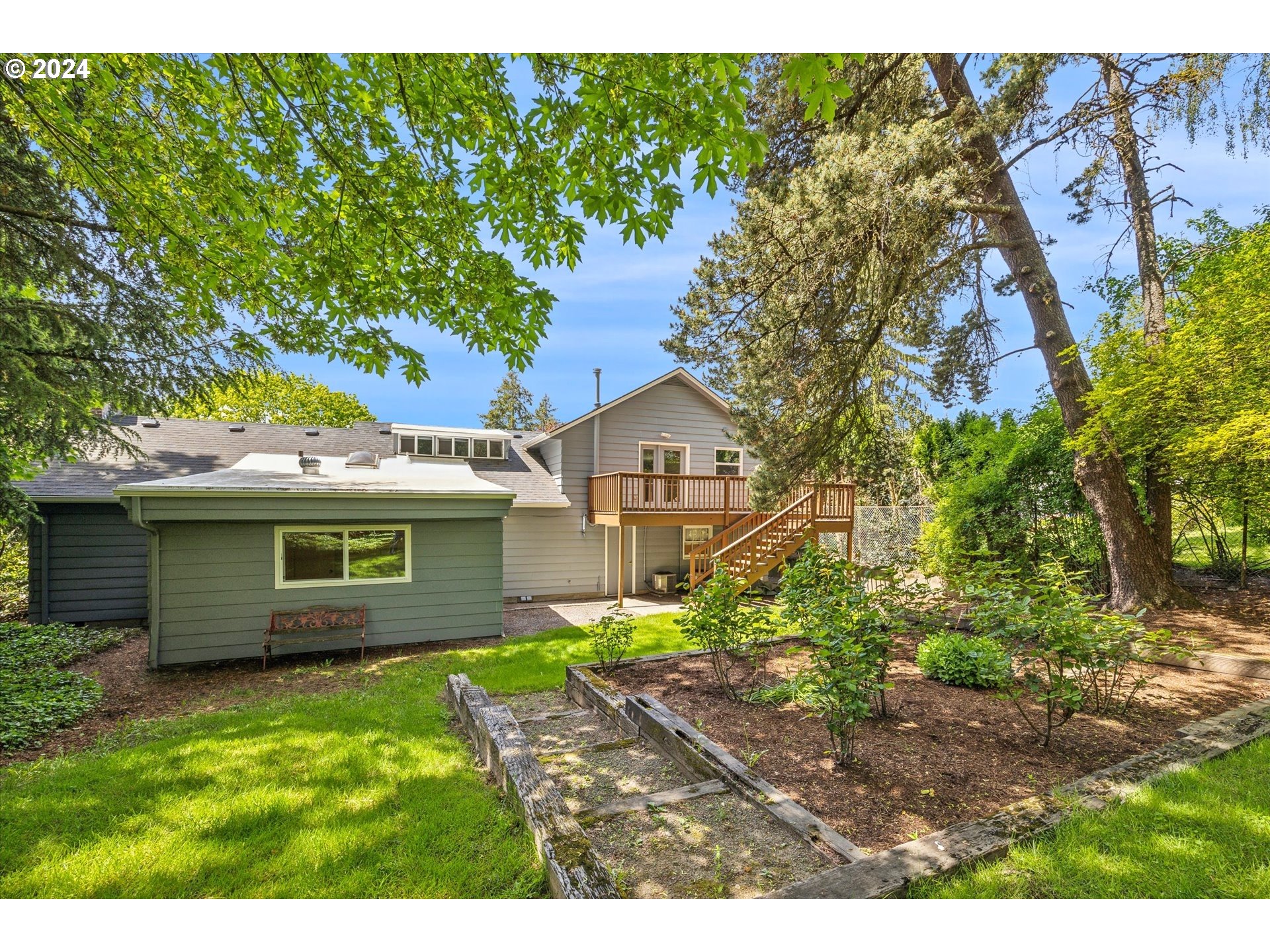 10097 Southwest Walker Road Portland, OR 97225 - Photo 41 of 44 a front view of a house with a garden