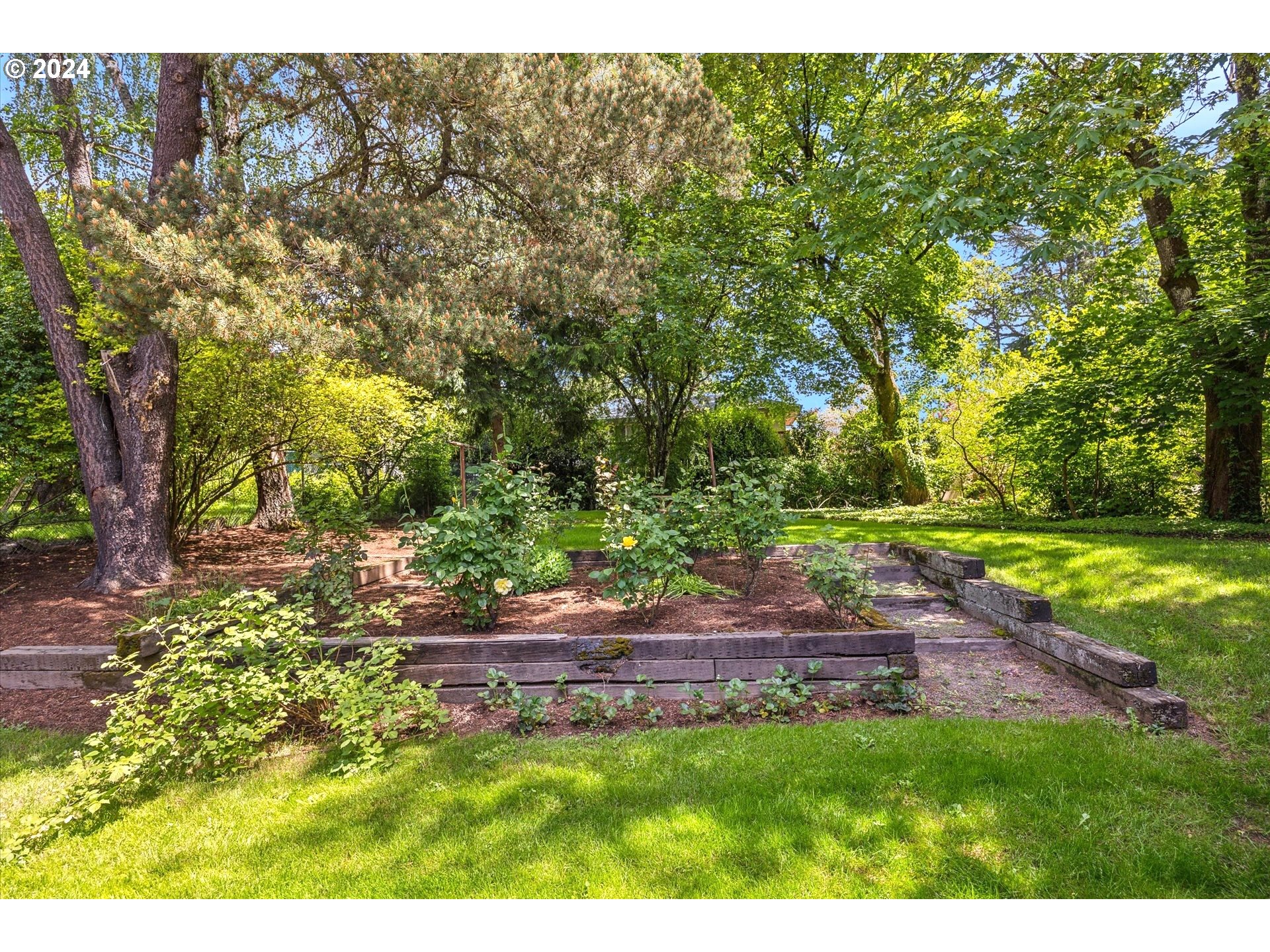 10097 Southwest Walker Road Portland, OR 97225 - Photo 42 of 44 a backyard of a house with yard and outdoor seating