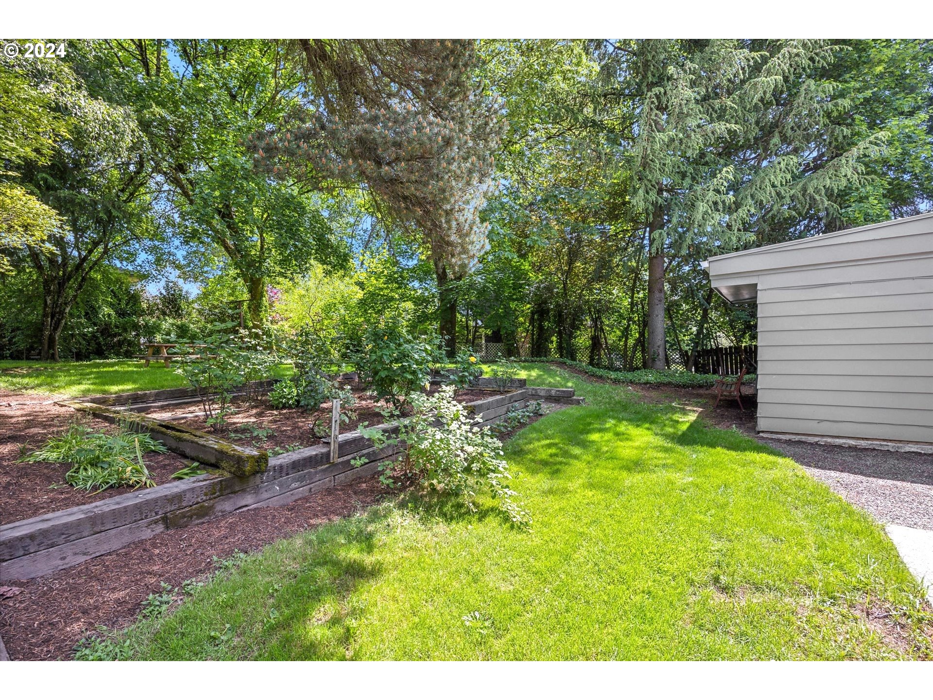 10097 Southwest Walker Road Portland, OR 97225 - Photo 43 of 44 a view of a backyard with a garden