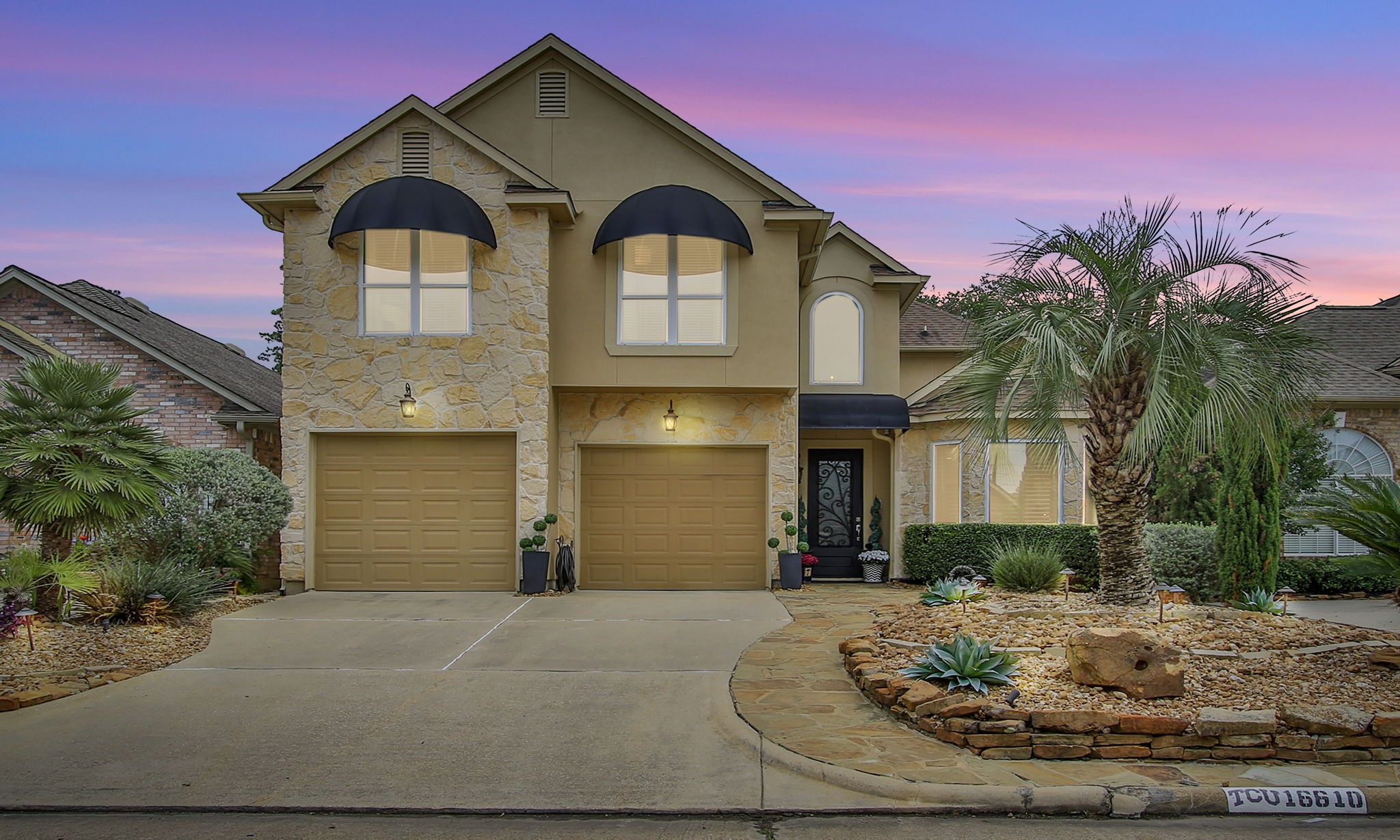 16610 Manningtree Lane Spring, TX 77379 - Photo 1 of 50 The home features stunning stucco and stone exterior with flagstone walk ways.