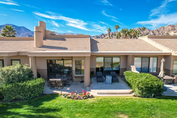 a view of a house with patio outdoor seating