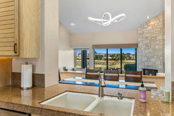 a living room with couch and a floor to ceiling window