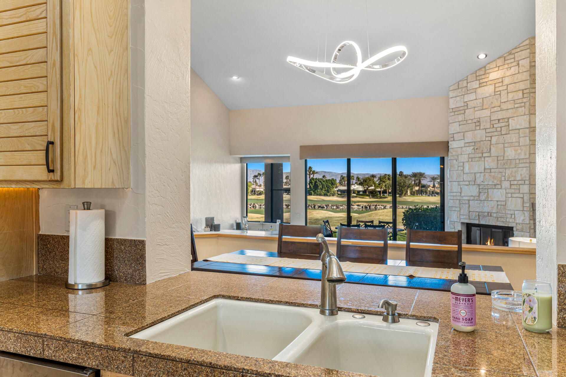 55764 Oak-Tree La Quinta, CA 92253 - Photo 12 of 50 a living room with couch and a floor to ceiling window
