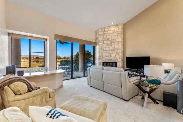 a living room with furniture fireplace and a flat screen tv