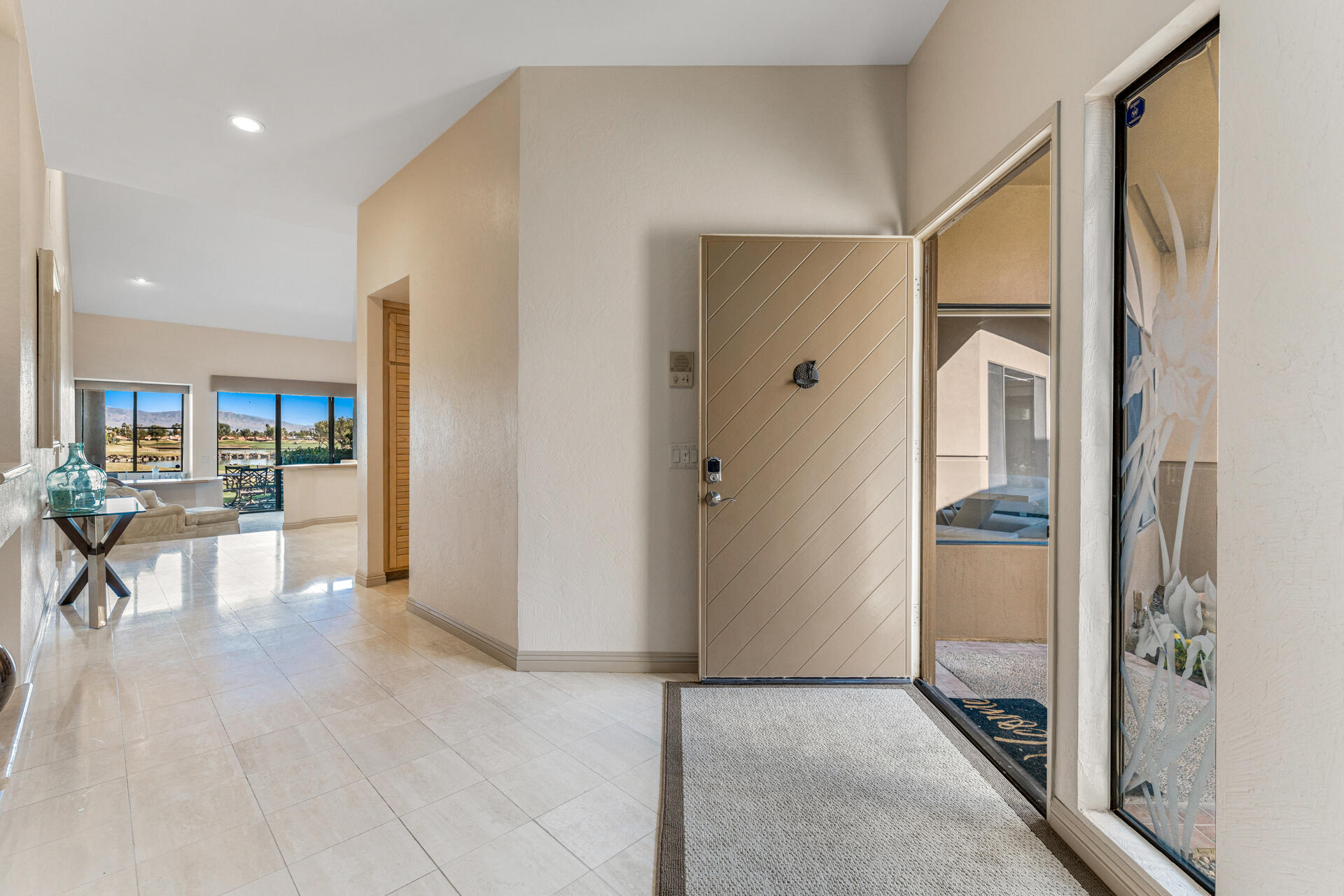 55764 Oak-Tree La Quinta, CA 92253 - Photo 22 of 50 a view of a hallway with dining area