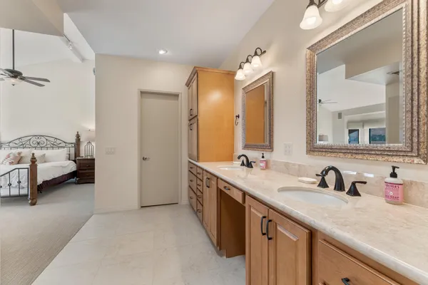 a spacious bathroom with a double vanity sink mirror and
