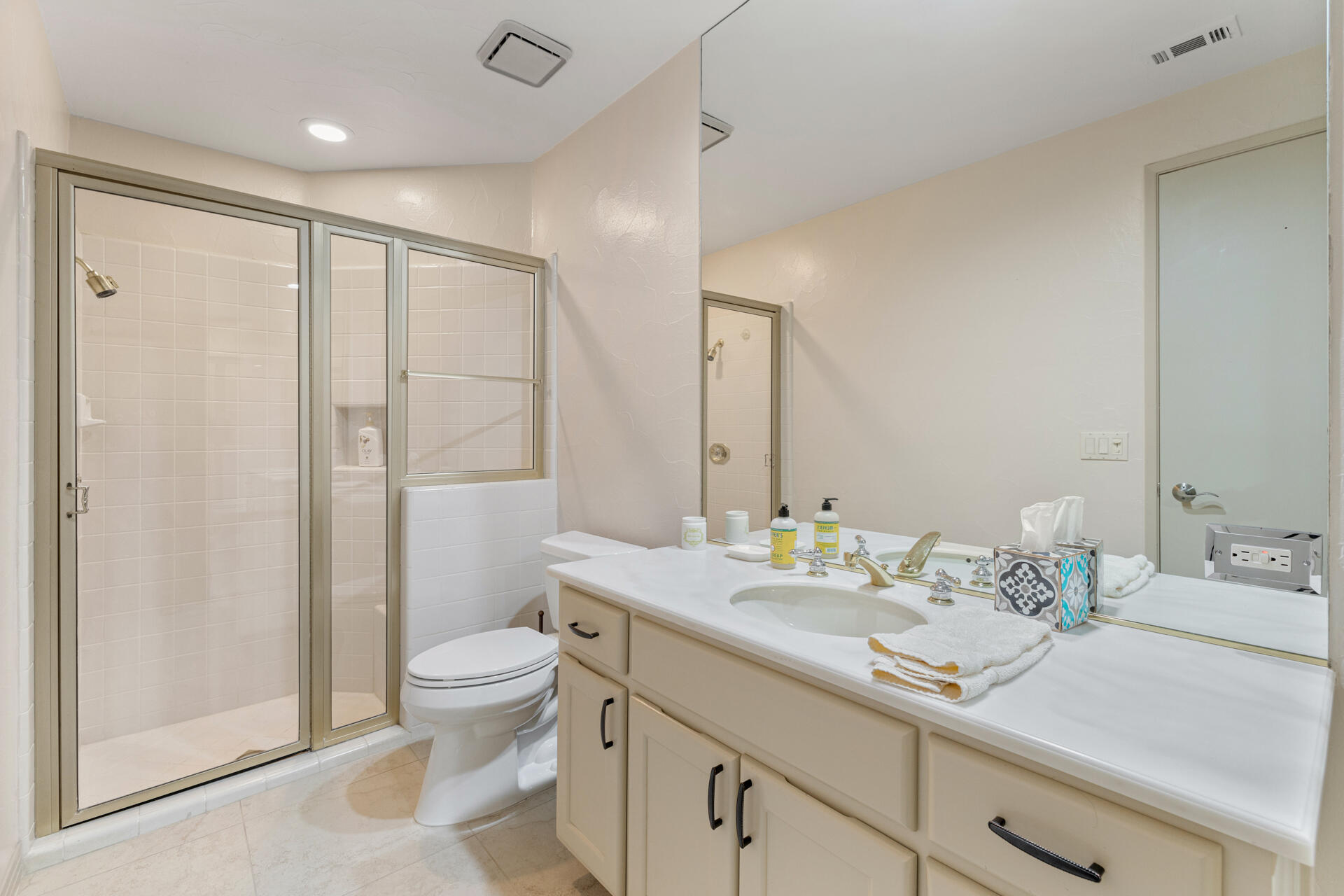 55764 Oak-Tree La Quinta, CA 92253 - Photo 30 of 50 a bathroom with a double vanity sink toilet and shower