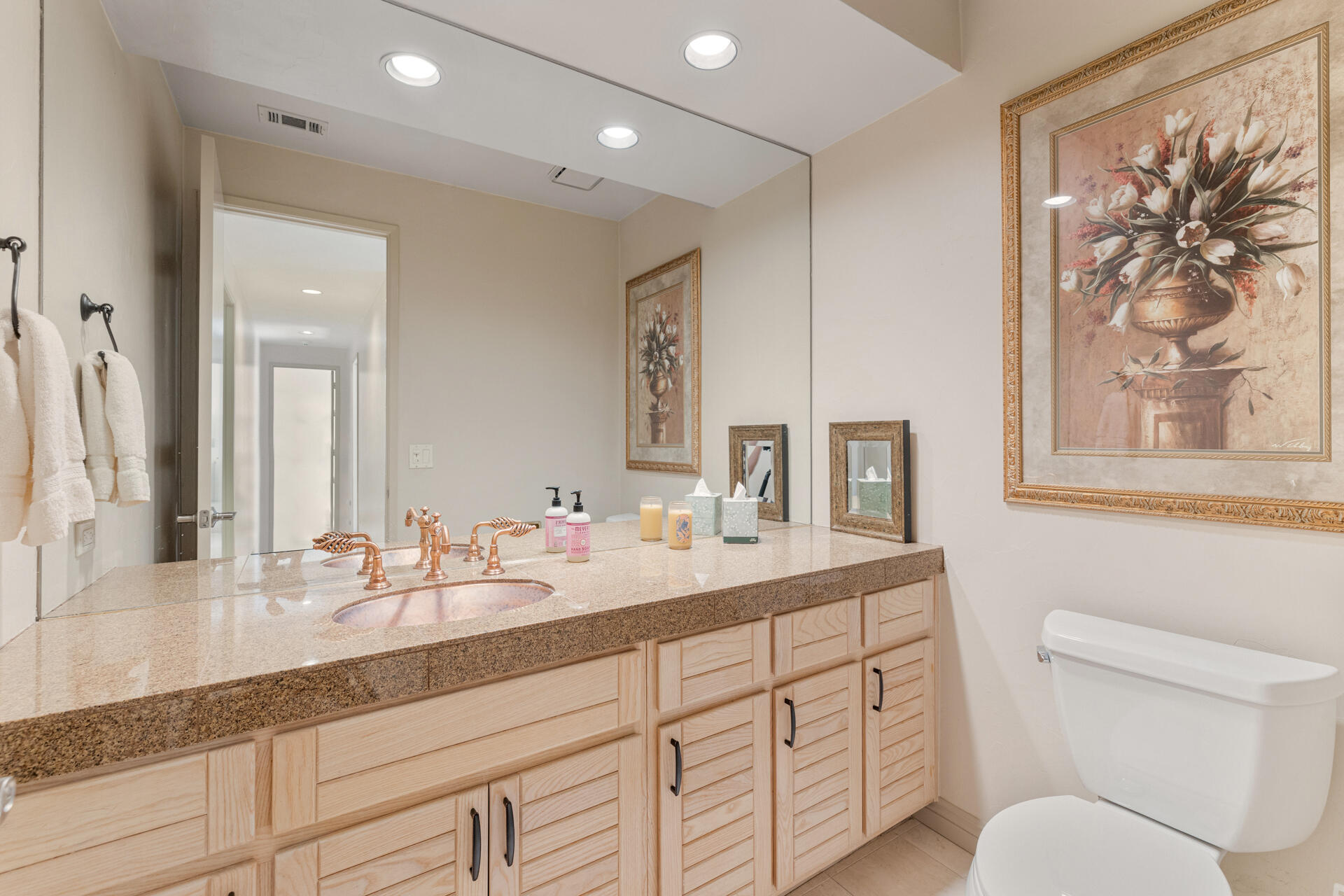 55764 Oak-Tree La Quinta, CA 92253 - Photo 31 of 50 a bathroom with a toilet a sink and mirror