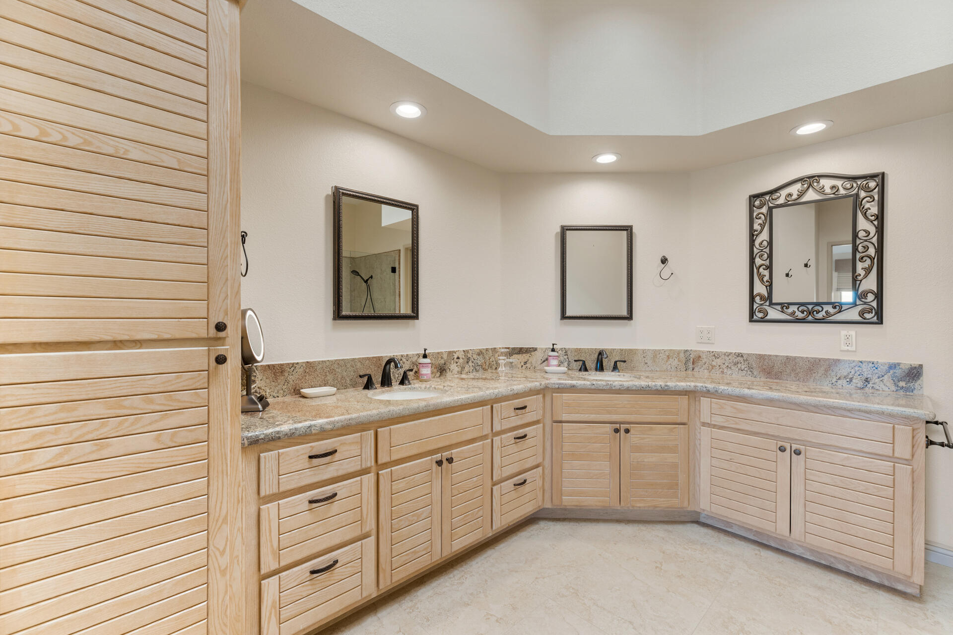 55764 Oak-Tree La Quinta, CA 92253 - Photo 34 of 50 a spacious bathroom with a double vanity sink and a mirror