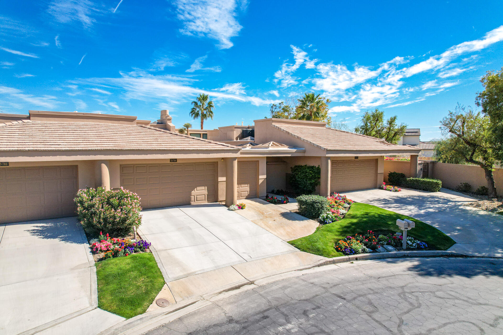55764 Oak-Tree La Quinta, CA 92253 - Photo 44 of 50 a front view of a house with garden