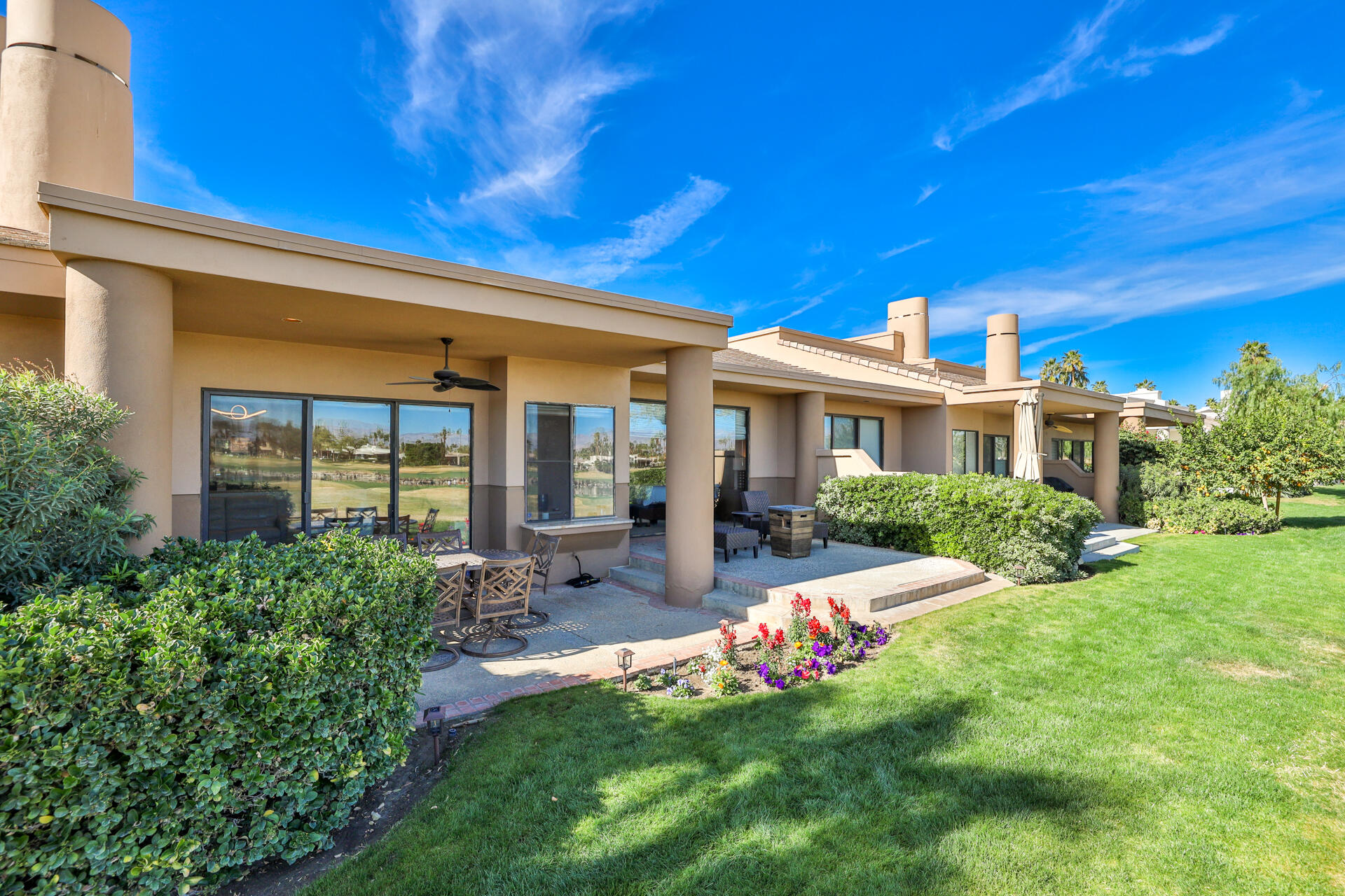 55764 Oak-Tree La Quinta, CA 92253 - Photo 7 of 50 a front view of a house with a yard