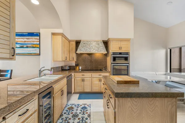 a kitchen with a sink stove and refrigerator
