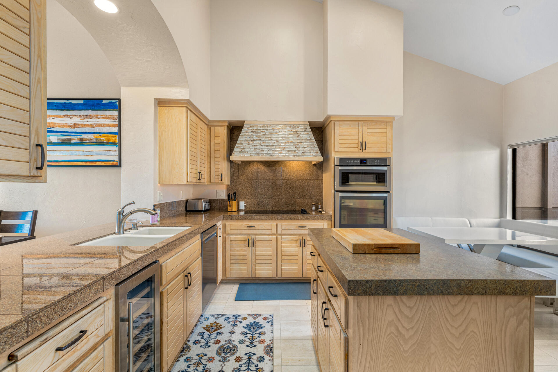 55764 Oak-Tree La Quinta, CA 92253 - Photo 8 of 50 a kitchen with a sink stove and refrigerator