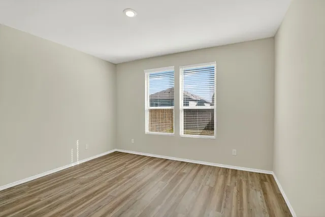 a bathroom with a granite countertop toilet a sink and a mirror