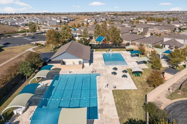 a view of swimming pool with outdoor seating