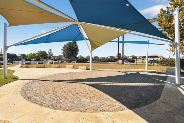 a childrens park with lots of swings and slides