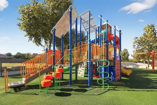 a view of a park with swings