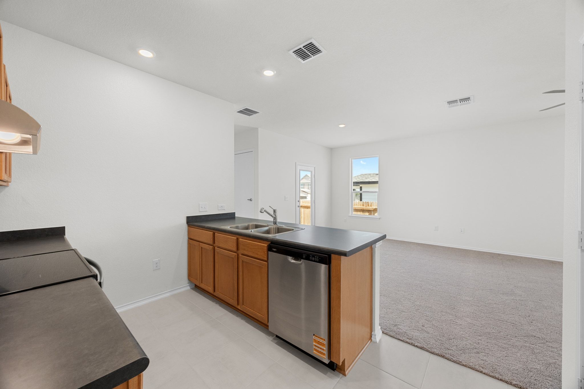 12102 Cantabria Road Austin, TX 78748 - Photo 12 of 29 a kitchen with stainless steel appliances a sink and a stove