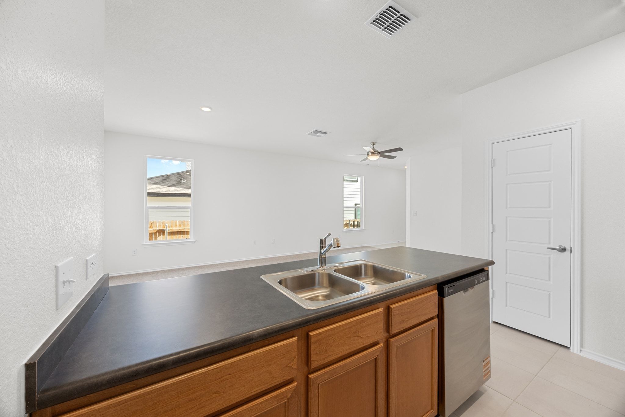 12102 Cantabria Road Austin, TX 78748 - Photo 13 of 29 a kitchen with a sink cabinets and window