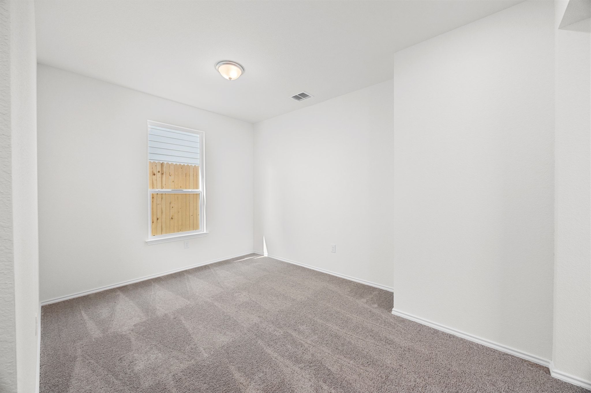 12102 Cantabria Road Austin, TX 78748 - Photo 19 of 29 a view of an empty room with a window
