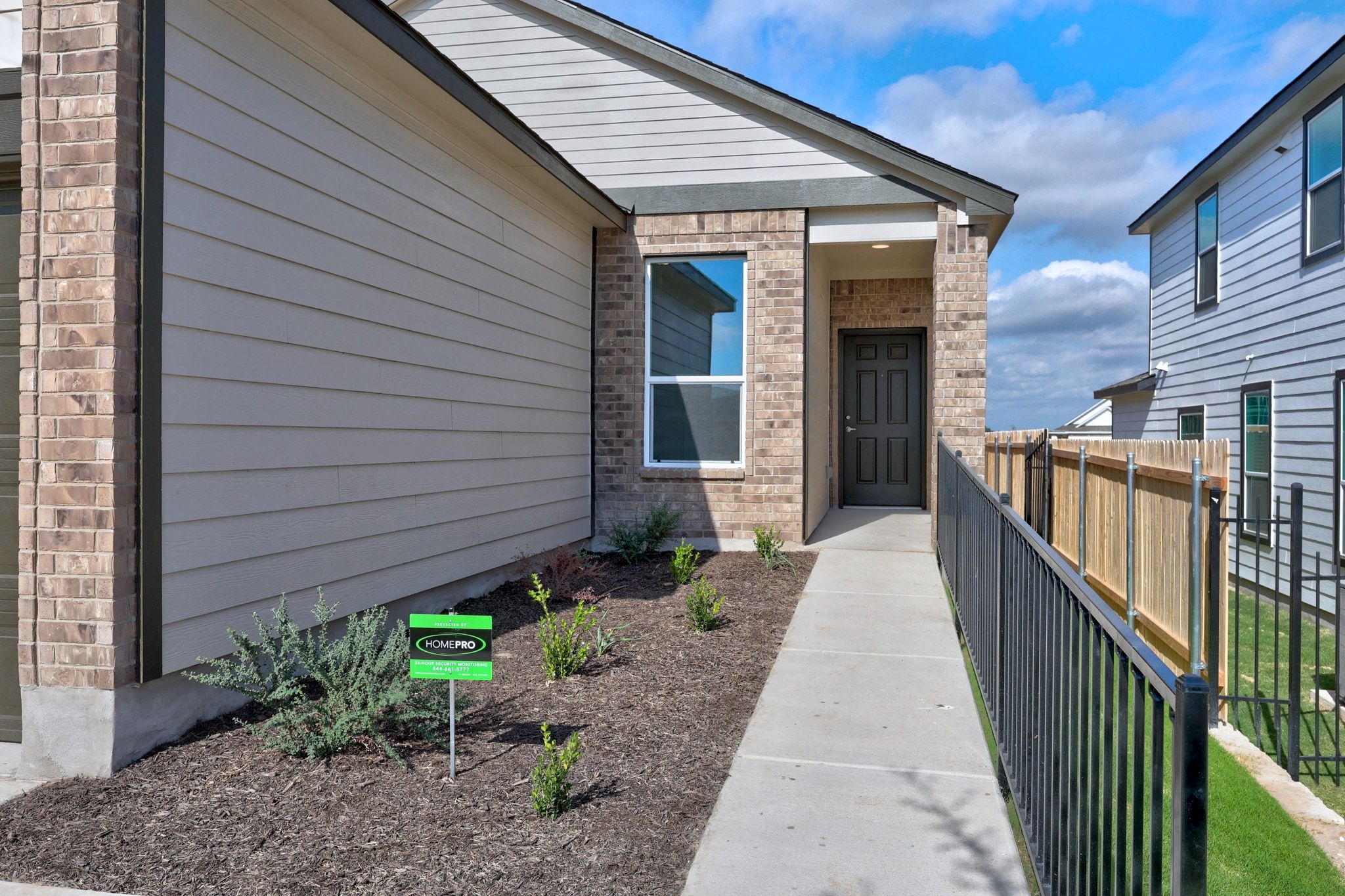 12102 Cantabria Road Austin, TX 78748 - Photo 3 of 29 a view of a house with wooden walls