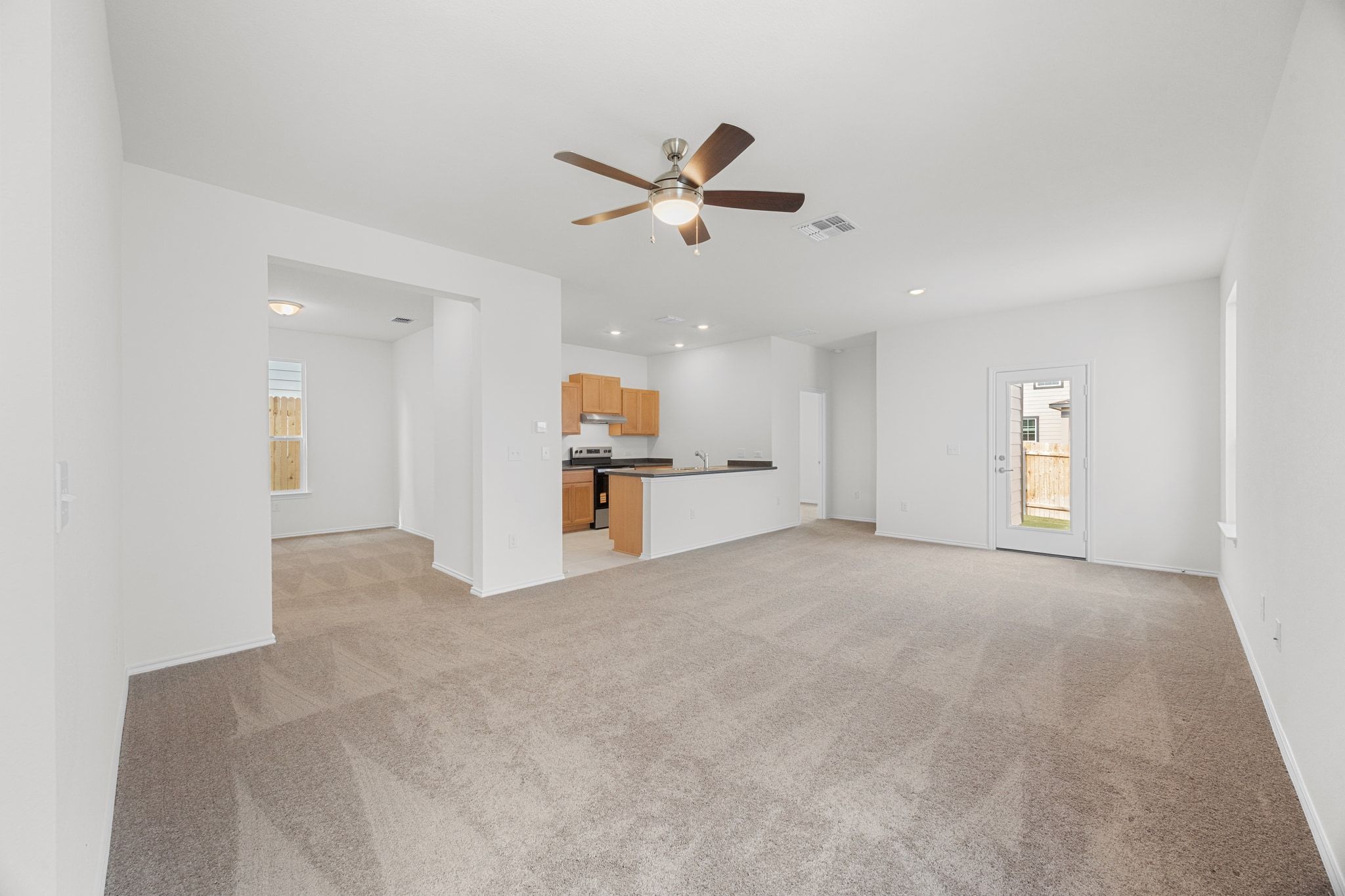 12102 Cantabria Road Austin, TX 78748 - Photo 5 of 29 a view of empty room with wooden floor and ceiling fan