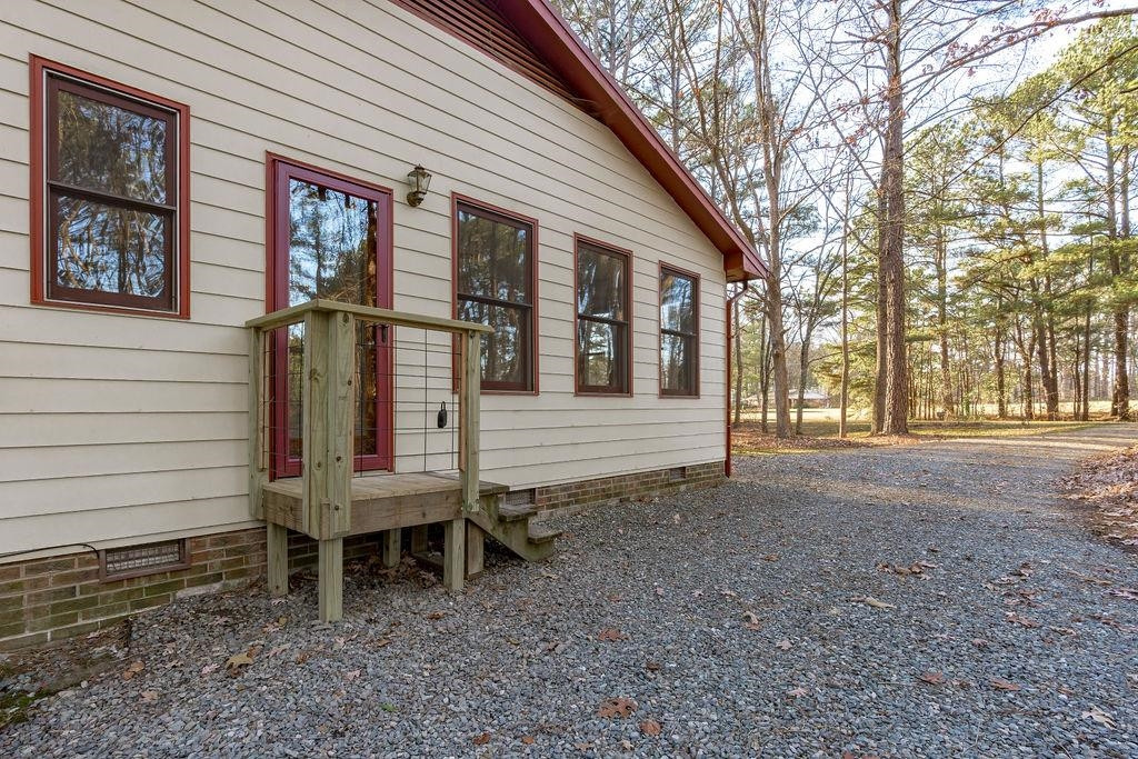 8933 Barker Road New Hill, NC 27562 - Photo 19 of 30 Side Entry into the Sun Room