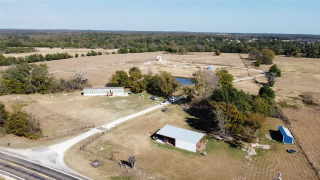 an aerial view of a house with ocean view
