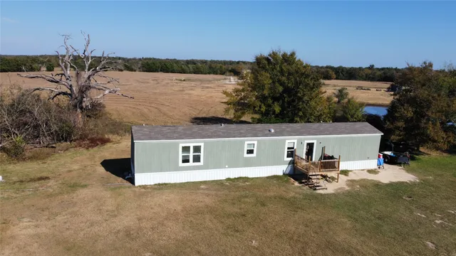 a view of house with outdoor space and sitting area