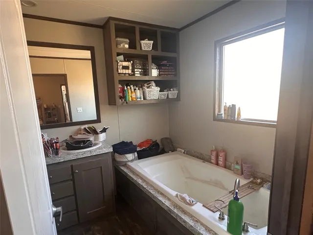 a bathroom with a sink and a window