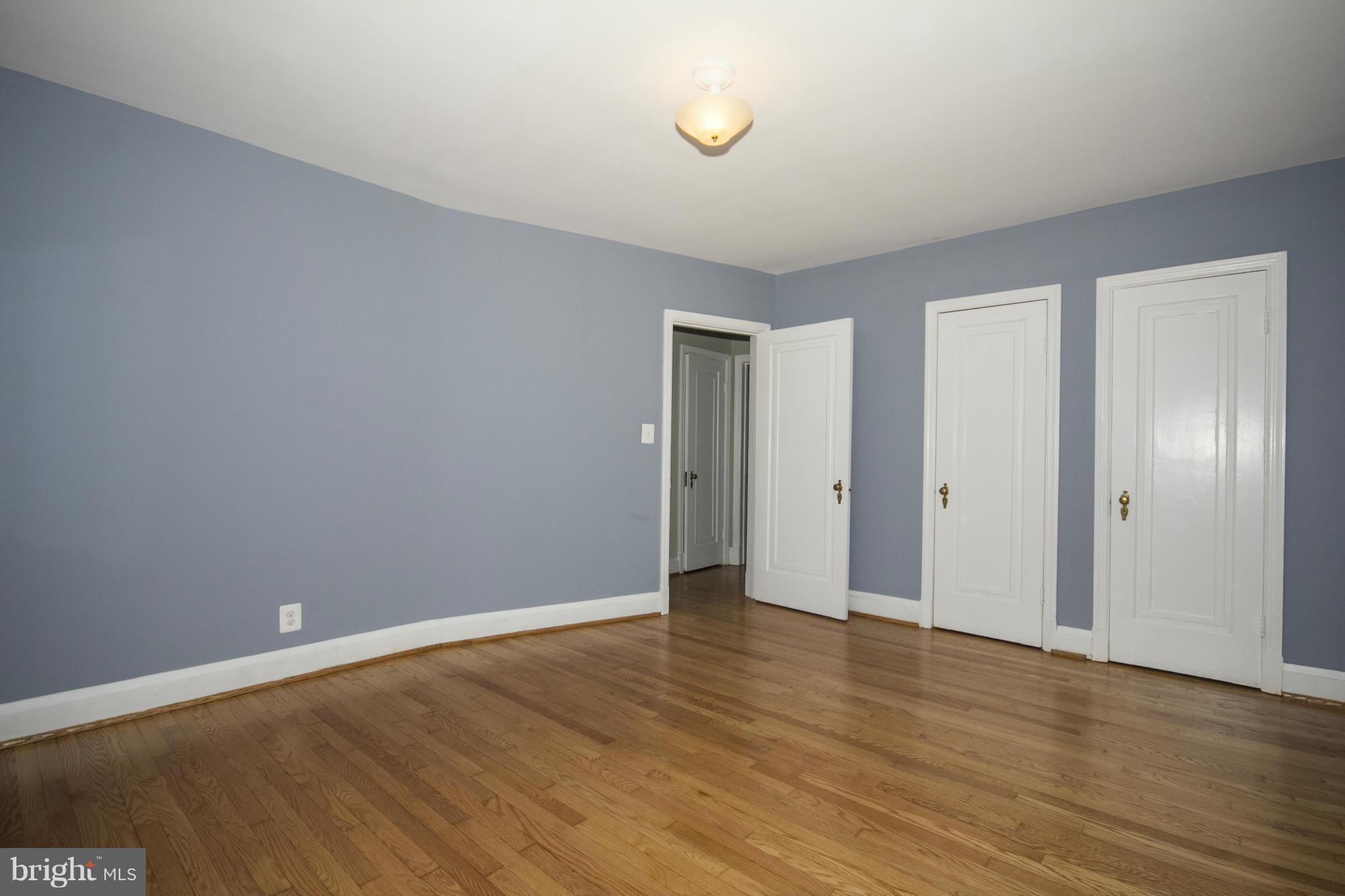 226 Murdock Road Baltimore, MD 21212 - Photo 9 of 19 a view of an empty room with wooden floor