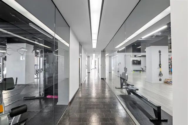 a view of gallery with wooden floor